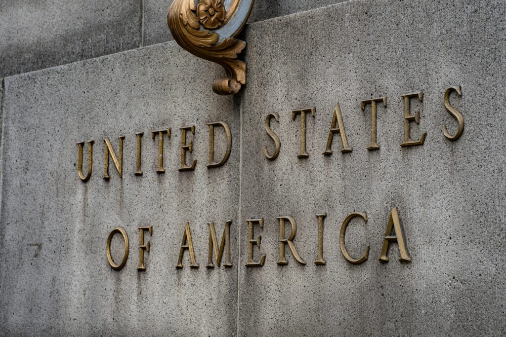 Close-up of United States of America text on a stone wall with vintage style.