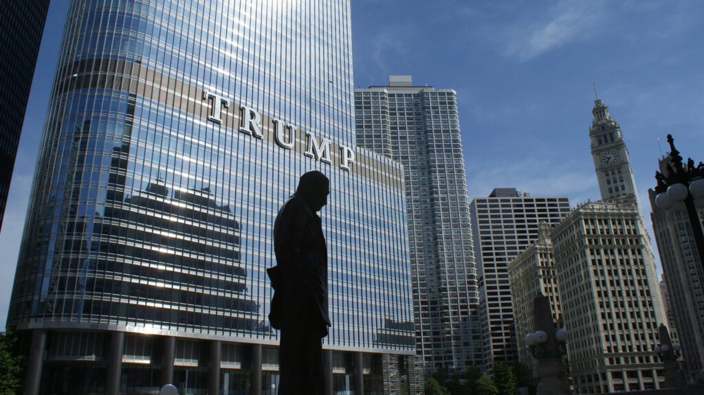 Captivating view of Chicago skyline with Trump Tower reflections and a silhouette in daylight.