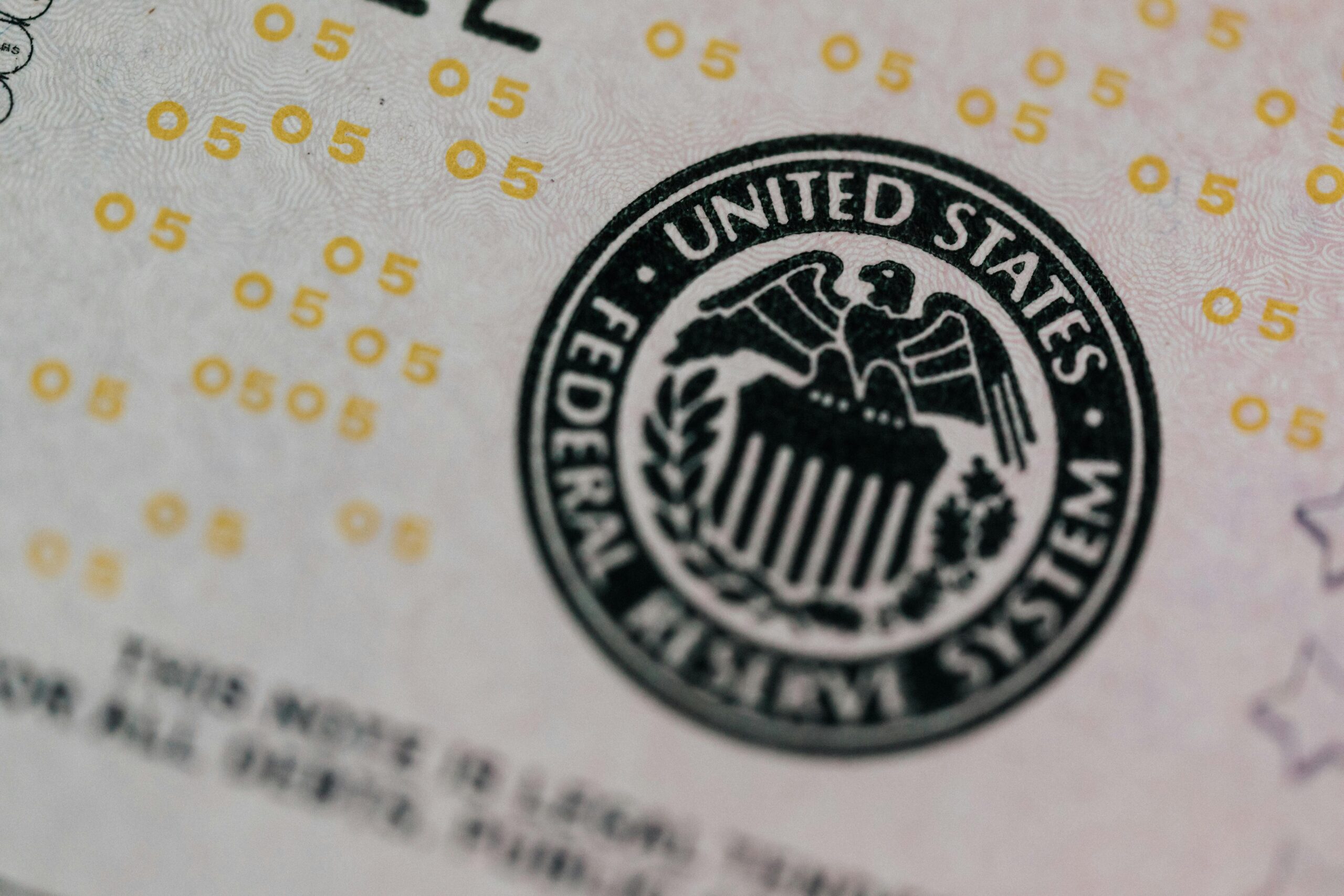 From above eagle on antique column in circle on banknote of Unites States placed on table