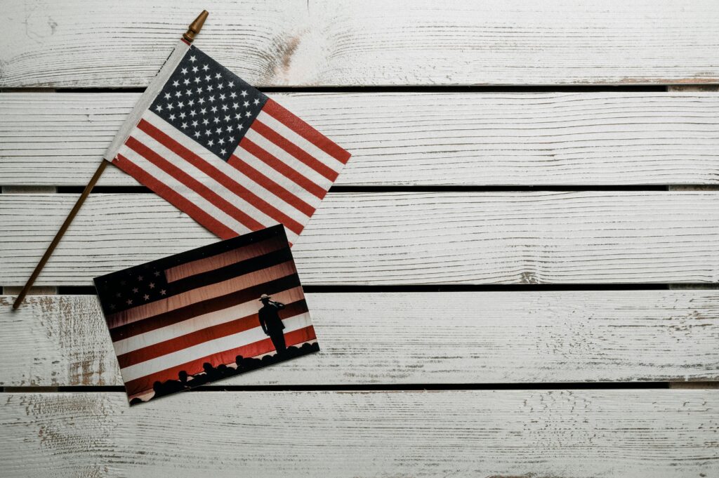 American flag and photo on rustic wooden planks evoke patriotism and vintage style.