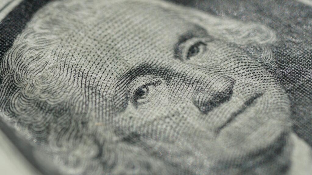 Detailed macro shot of a U.S. dollar bill showing intricate texture and design features.